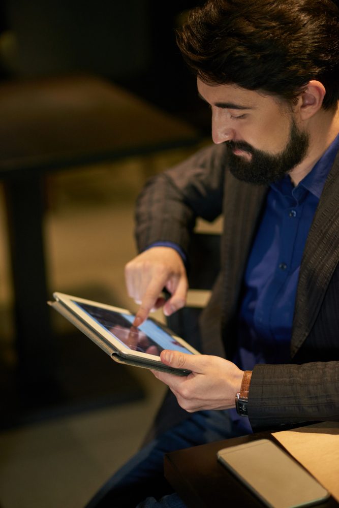 Man reviewing information on a tablet